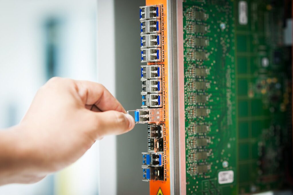 Engineer fixing core swith in data center room